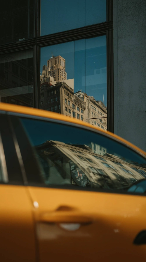 New York buildings reflecting in taxi cab window New York buildings reflecting in taxi cab window
