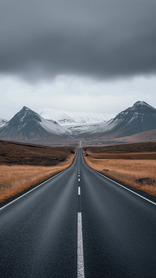 Straight road leading to the mountains in Iceland